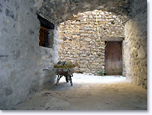Sainte Euphemie sur Ouveze, vaulted passageway with wheelbarrow