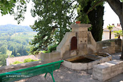 La Roque sur Pernes, fountain, bench and landscape