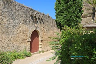 Les Taillades, stone wall and old door